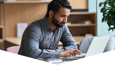 A man looking at this laptop