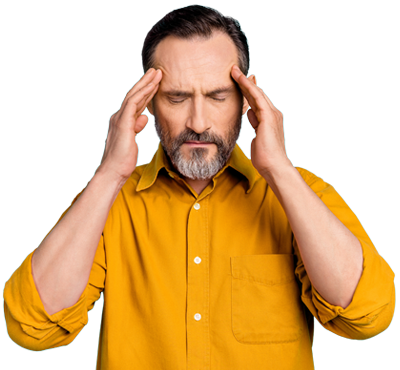 A stressed man holding his head