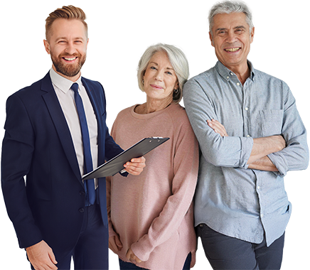 An advisor with a clipboard next to a smiling older couple
